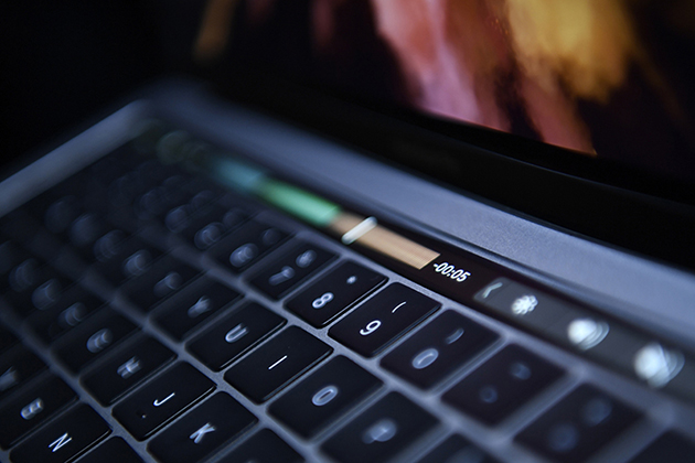 The Touch Bar is seen on a new MacBook Pro laptop computer during an event at Apple Inc. headquarters in Cupertino, California, U.S., on Thursday, Oct. 27, 2016. Apple Inc. introduced the first overhaul of its MacBook Pro laptop in more than four years, demonstrating dedication to a product that represents a small percentage of revenue. Photographer: David Paul Morris/Bloomberg