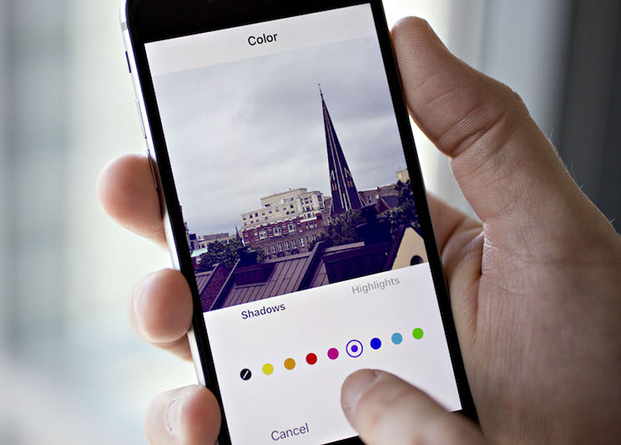 Facebook Inc.'s Instagram application is demonstrated on an Apple Inc. iPhone in this arranged photograph taken in Washington, D.C., U.S., on Friday, June 17, 2016. In a bid to give its users an incentive to create more content for the photo and video-sharing site, Facebook's Instagram is considering sharing revenue generated from news, sports, celebrities and other content said Carolyn Everson, vice president for global marketing solutions at Facebook. Photographer: Andrew Harrer/Bloomberg